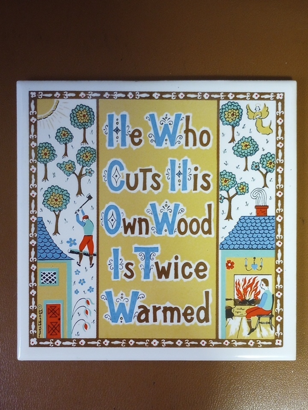 Berggren Ceramic Tile Vintage Trivet. He Who Cuts His Own Wood Is Twice Warmed
